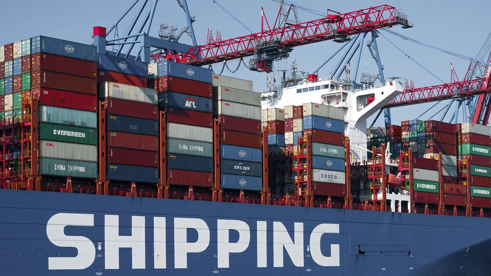 Aerial view of a busy container shipping port used for exporting engineering materials and precision components